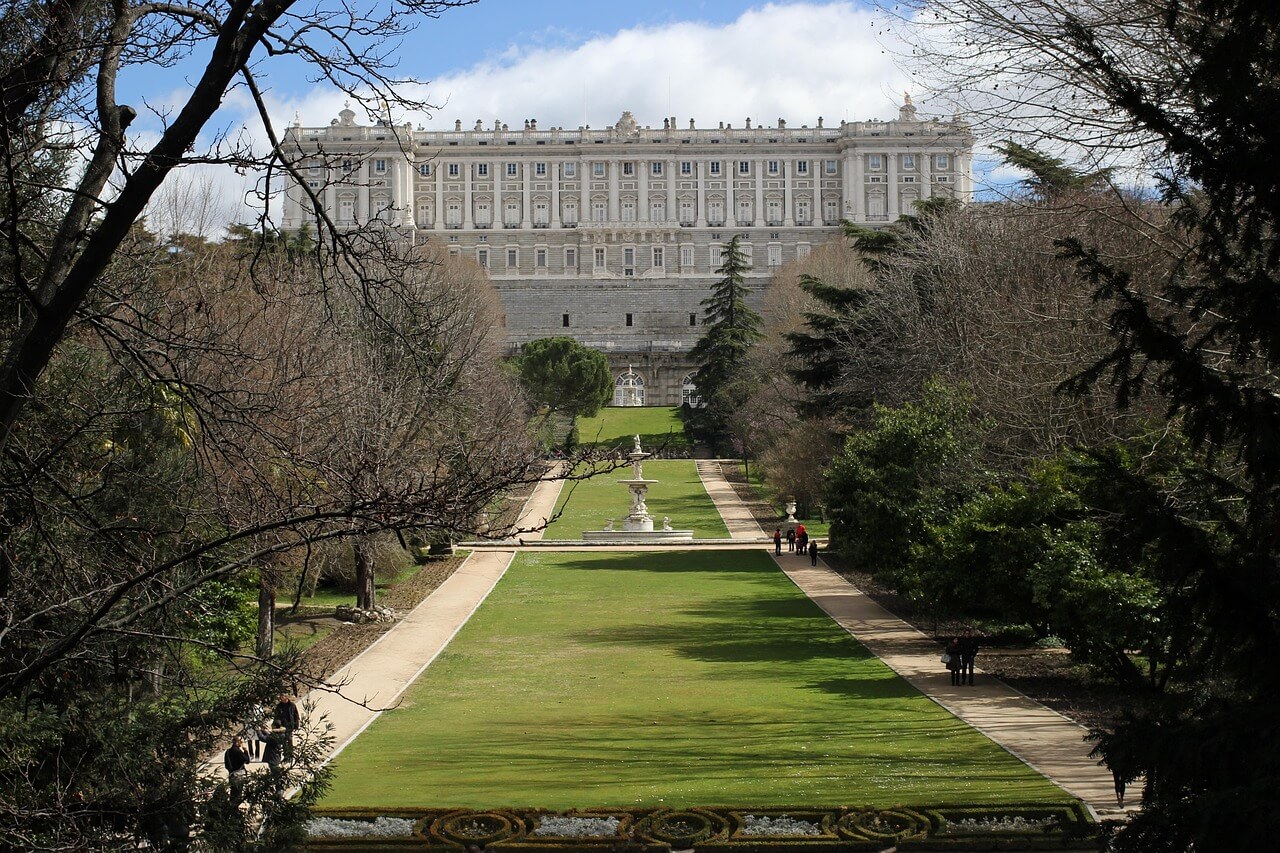 Front view of the Royal Palace of Madrid under a blue sky