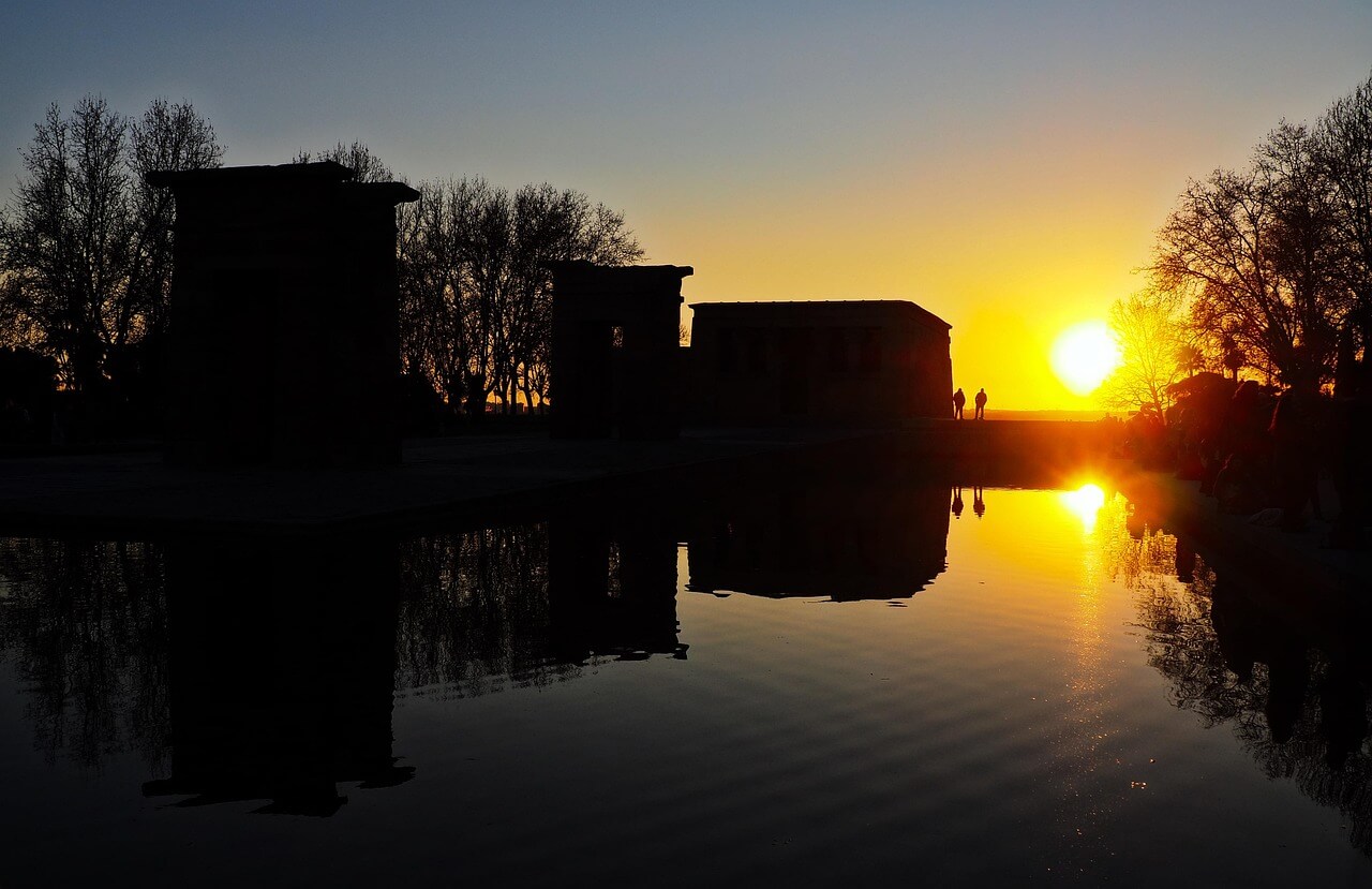 Temple of Debod in Madrid during golden hour with reflection in water